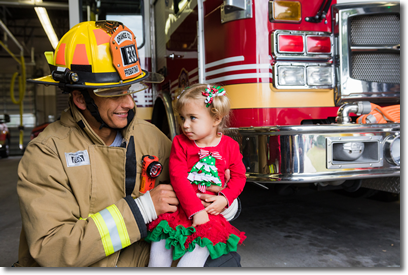 Young girl with a firefighter